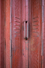 A detail of the metal folding door of the entrance