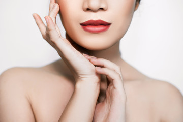 beautiful woman's face From nose to chest Showing bright red lips And clean, healthy natural skin cleared, under the concept of beauty And skin care