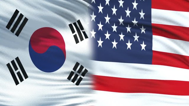 USA and South Korea politicians exchanging top secret envelopes, against flags