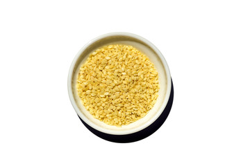Saucer dish with sesame seeds isolated on white background