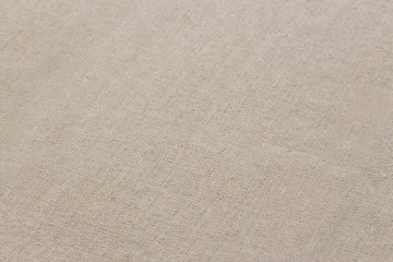 Fototapeta na wymiar 45° overhead shot vintage beige linen cloth texture closeup