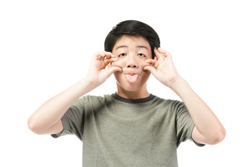 little asian  boy with black hair in funny acting trying to amusing .