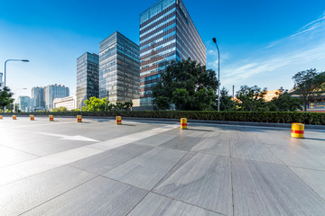 Panoramic skyline and modern business office buildings with empty road,empty concrete square floor