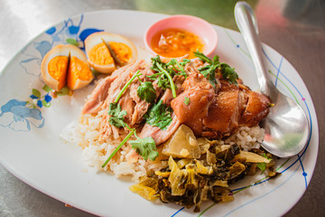 Stewed pork leg on rice, Thai street food.