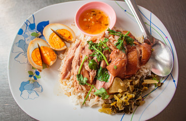 Stewed pork leg on rice, Thai street food.