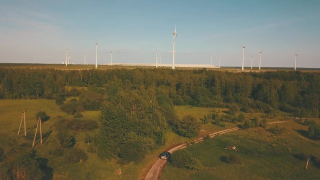 Windmills in summer filde in Estonia, drone footage