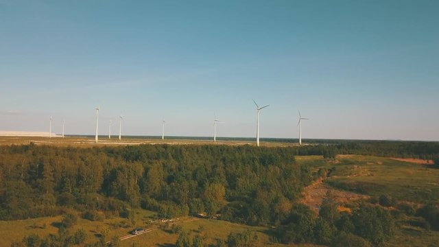 Windmills in summer filde in Estonia, drone footage