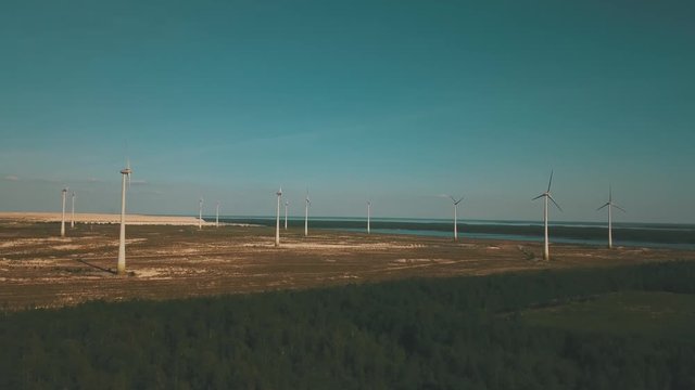 Windmills in summer filde in Estonia, drone footage
