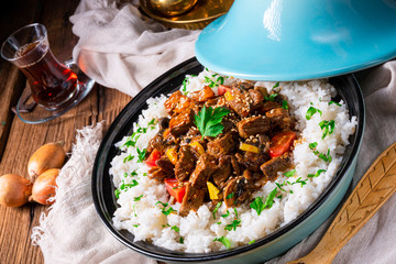 Tajin beef stew with rice paprika and sesame seeds