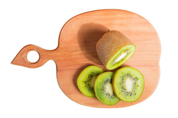 Top view of wooden cutting board with sliced kiwi isolated on white background