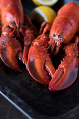Seafood lobsters with lemon. Fresh beautiful large sea lobsters.