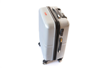 Fototapeta premium One suitcase isolated on white background. Polycarbonate suitcase isolated on white. Grey suitcase
