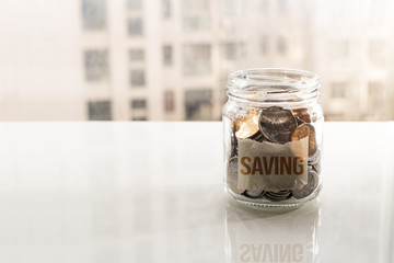save money, coins in glass jar for money saving financial concept