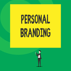Word writing text Personal Branding. Business concept for Practice of People Marketing themselves Image as Brands Isolated view young man standing pointing upwards two hands big rectangle.