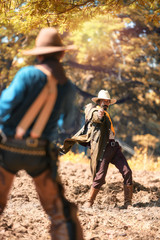 Cowboy with gun prepares to gunfight