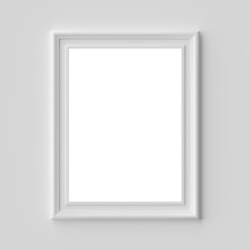 White picture or photo frame on white wall vertical with copy-space