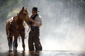 cowboy portrait.cowboy take care horse with love and caring.