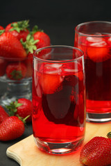 Glasses with strawberry drink with ice