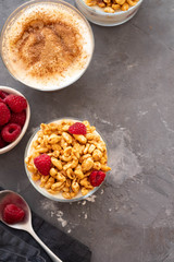 Bowl of granola with yogurt and fresh berries on black background from top view. Healthy breakfast. Copy space.