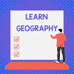 Text sign showing Learn Geography. Business photo text study of physical features of earth and its atmosphere Back view young man dressed suit standing platform facing blank rectangle