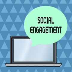 Fototapeta premium Text sign showing Social Engagement. Business photo showcasing Degree of engagement in an online community or society Round Shape Empty Speech Bubble Floating Over Open Laptop Colored Backdrop