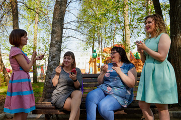 Group of female friends walking in the park