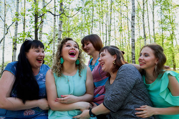Group of female friends walking in the park