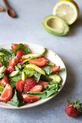salad with avocado, strawberries and spinach