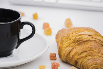 Breakfast with croissants and fruits