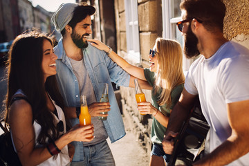 Happy young people having fun spending good time together