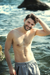 Young stylish man outdoor portrait near the sea