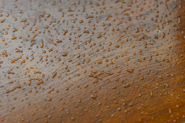 water drops on wooden surface. droplets of raindrop. background