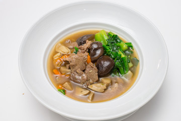 Fried noodle with beef , shiitake and chinese kale in gravy