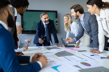 Group of architects and business people working together and brainstorming