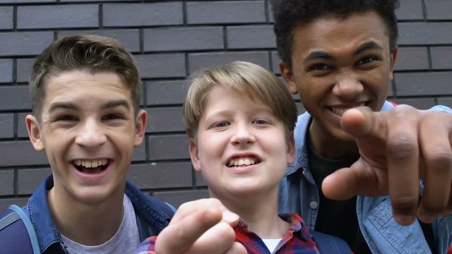 Group of multiracial students mocking victim, psychological problems, phobia
