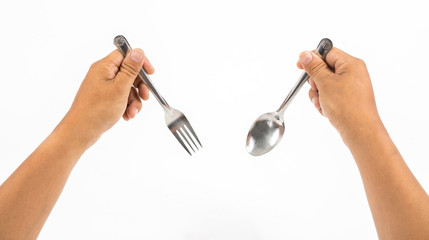 hands hold folk and spoon on white background
