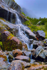 Northern waterfall with rocks, pure springs, rocks and rills, northern landscape