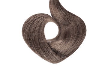 Brown hair isolated on white background. Heart shape
