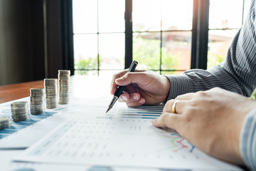 strategy analysis concept, Businessman working  financial Manager Researching Process accounting calculate analyse market graph data stock information review on the table in office.