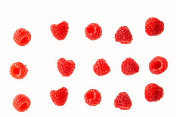 raspberry berries isolated on a white background in a chaotic manner .