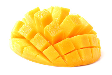 Mango slice cut to cubes close-up isolated on white background