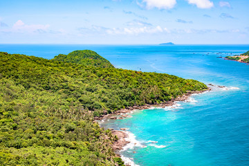 Beautiful tropical island with blue clear water and granite stones. Top view.