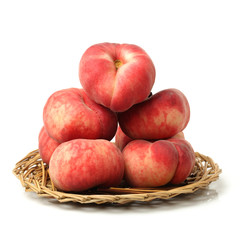 chinese flat peaches on white background 