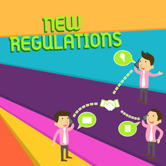 Handwriting text New Regulations. Conceptual photo Regulation controlling the activity usually used by rules. Businessmen Coworkers Conference Call Conversation Discussion Mobile Phones