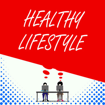 Text sign showing Healthy Lifestyle. Business photo text Live Healthy Engage in physical activity and exercise Two men sitting behind desk each one laptop sharing blank thought bubble