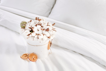 Fototapeta na wymiar Original and beautiful cotton flowers bouquet in a white bowle