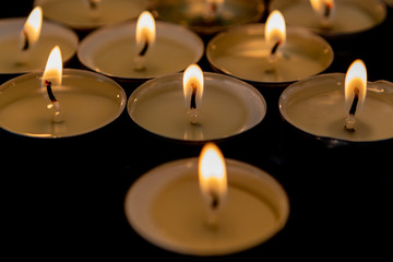 Many small burning candles