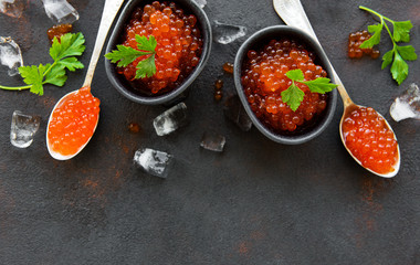 Red caviar on a black background
