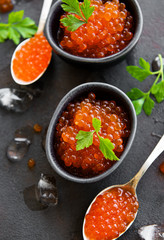 Red caviar on a black background