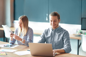 Young people having business meeting in modern office